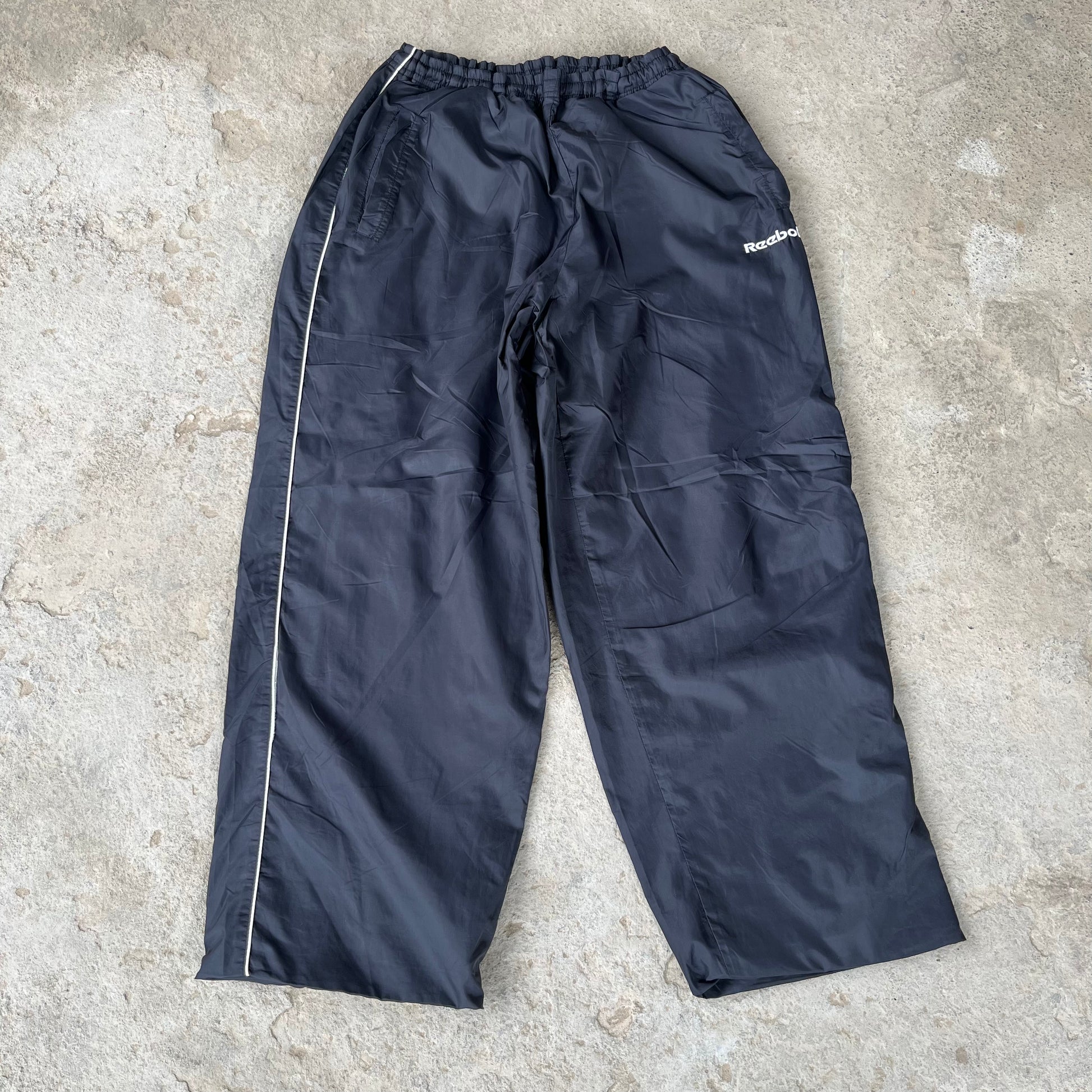 REEB0K TRACK PANTS